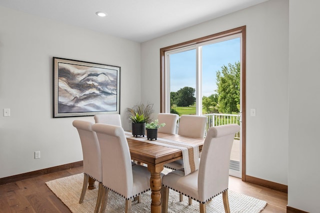 dining area with hardwood / wood-style flooring