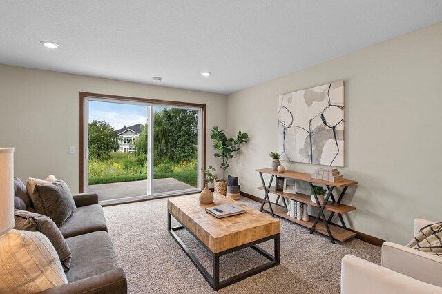 living room featuring light carpet