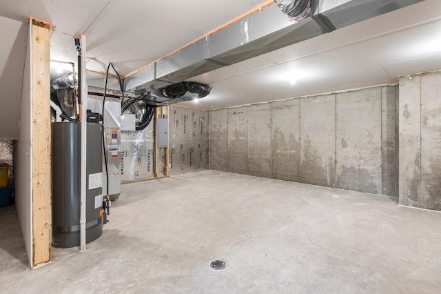 basement with water heater and electric panel