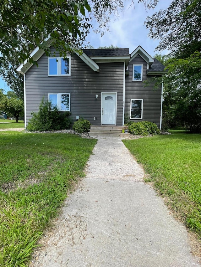 view of property featuring a front yard