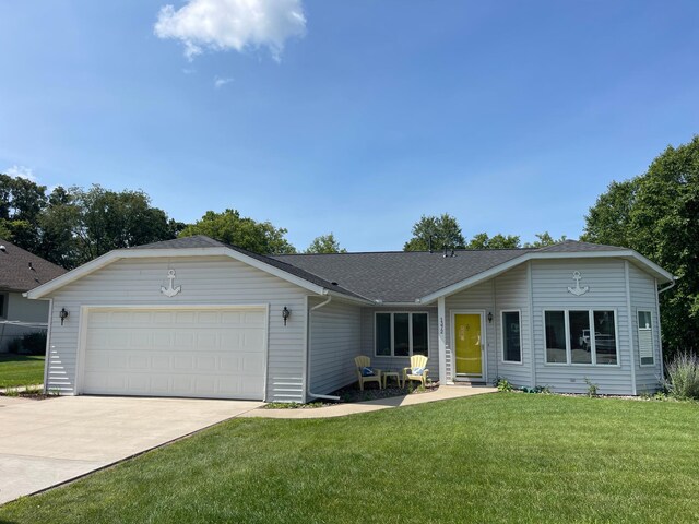 ranch-style home with driveway, an attached garage, a shingled roof, and a front yard