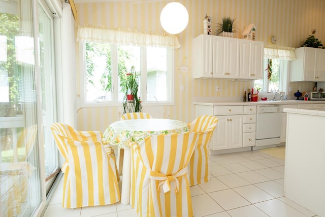 interior space with light tile patterned floors and plenty of natural light