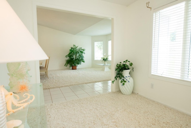 corridor with light tile patterned floors