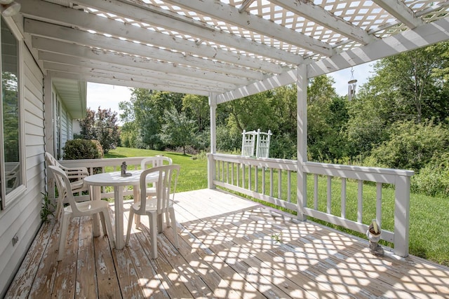 deck featuring a yard and a pergola