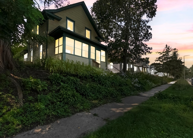 view of property exterior at dusk