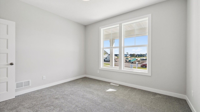 spare room with carpet flooring