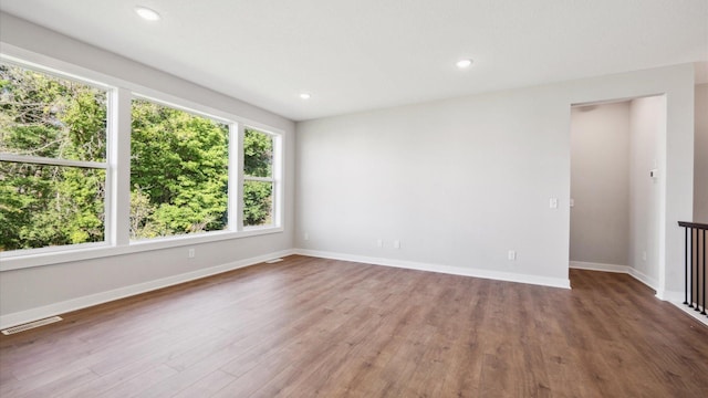 spare room featuring hardwood / wood-style floors