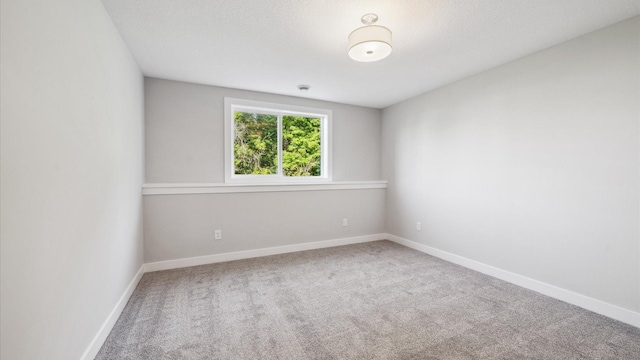 empty room featuring carpet flooring