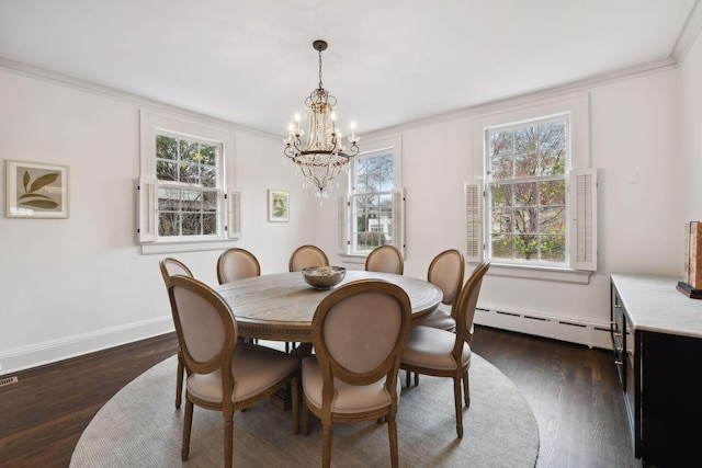 dining space with dark hardwood / wood-style flooring, crown molding, a baseboard radiator, and an inviting chandelier