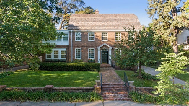 colonial inspired home with a front yard