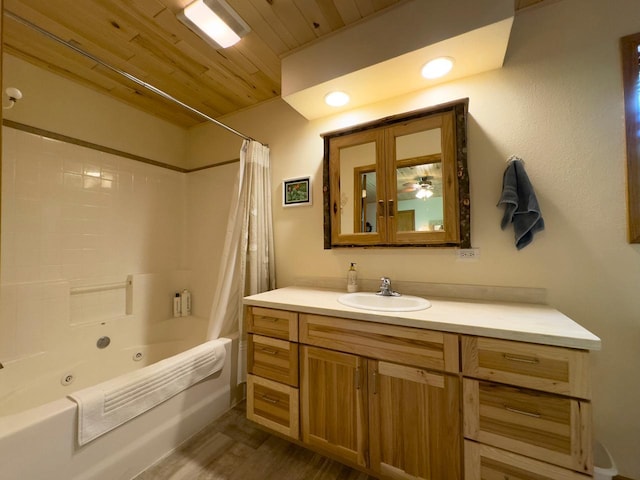 full bathroom featuring a combined bath / shower with jetted tub, wood finished floors, wood ceiling, and vanity