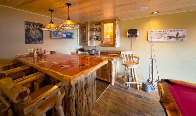 bar with billiards, decorative light fixtures, wood ceiling, and dark wood finished floors