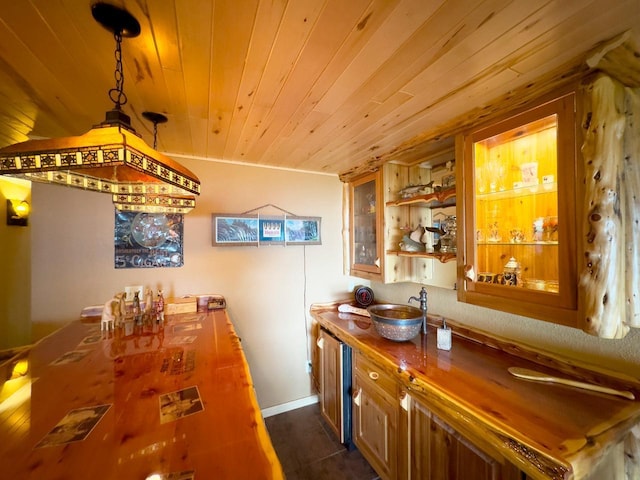 kitchen featuring open shelves, baseboards, wood ceiling, brown cabinetry, and glass insert cabinets