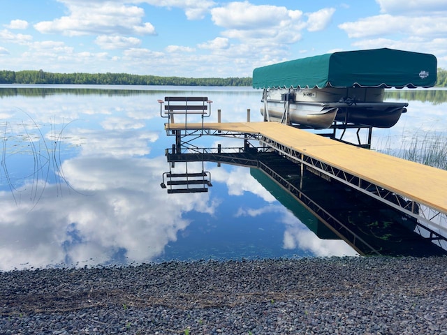 dock area featuring a water view and boat lift