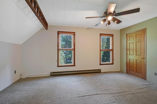 bonus room with plenty of natural light, ceiling fan, a baseboard heating unit, and carpet flooring