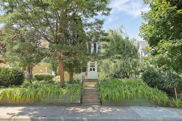 view of property hidden behind natural elements