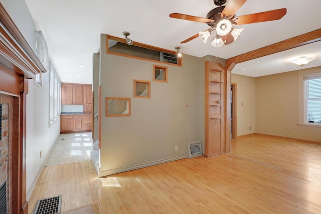 unfurnished room featuring light tile patterned floors and ceiling fan