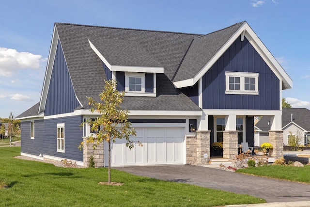 view of front of home featuring a garage and a front lawn