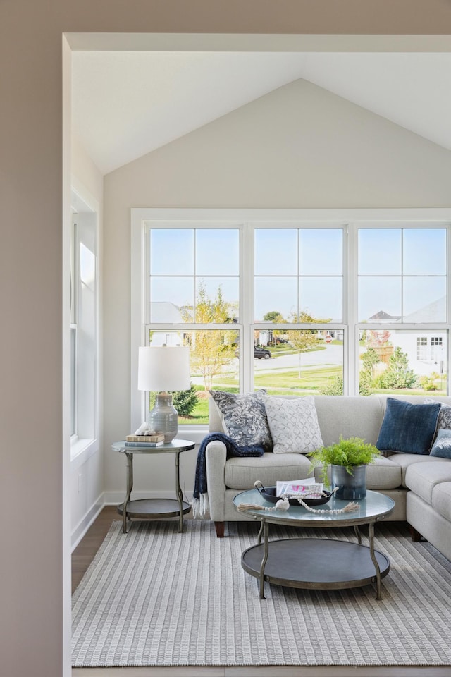 sunroom featuring lofted ceiling