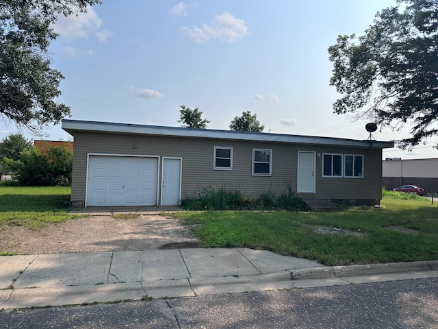 ranch-style house with a garage and a front yard