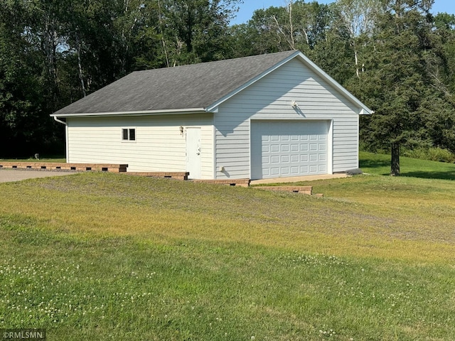 garage featuring a lawn