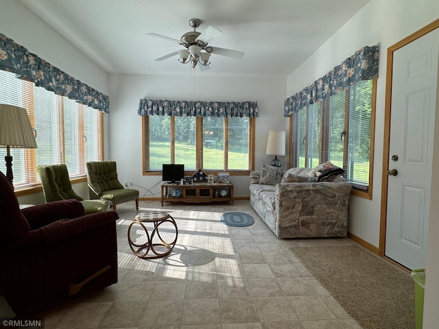 living room featuring light tile patterned flooring and ceiling fan