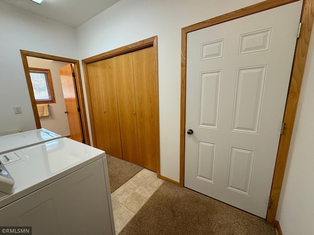 washroom with washer / clothes dryer and light carpet