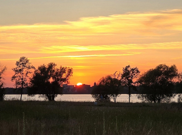 nature at dusk featuring a water view