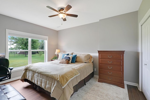 bedroom featuring wood-type flooring and ceiling fan