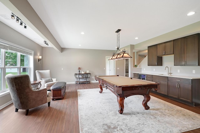 game room with pool table, sink, and dark hardwood / wood-style flooring