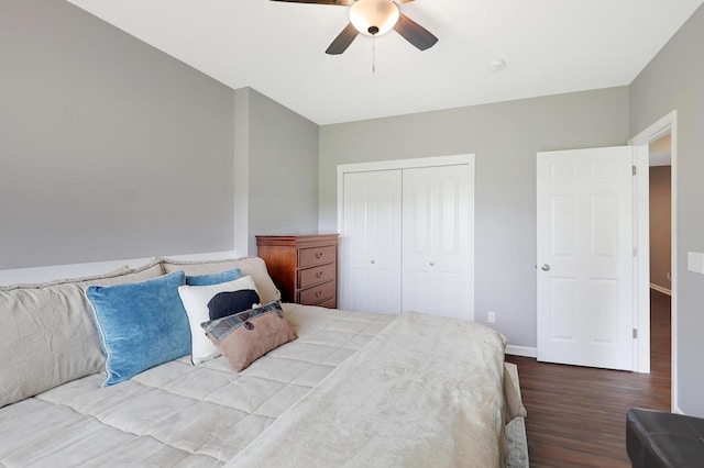 bedroom featuring ceiling fan, a closet, and hardwood / wood-style flooring