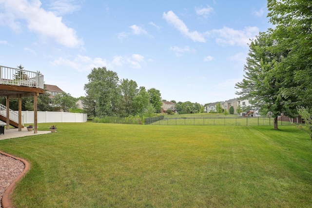 view of yard featuring a wooden deck