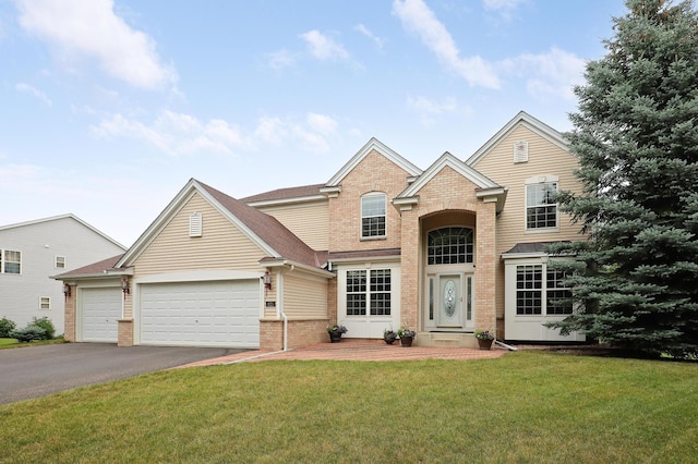 front of property featuring a front lawn and a garage