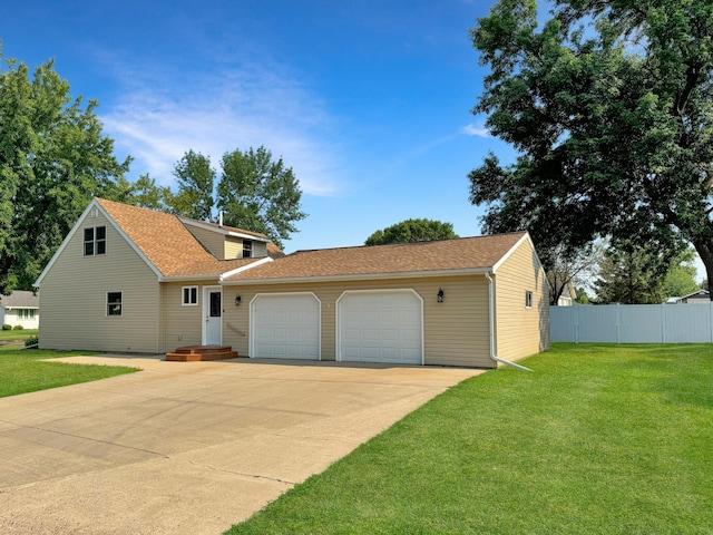 view of front of home featuring a garage and a front yard