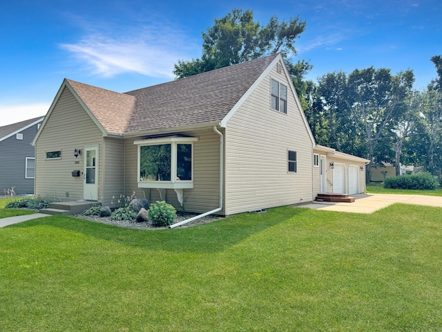 exterior space with a garage and a lawn