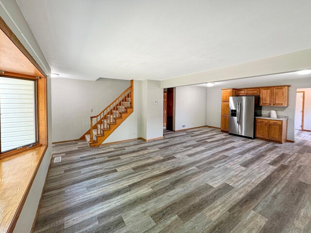 unfurnished living room featuring hardwood / wood-style flooring