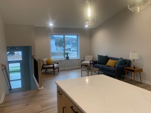 living room with lofted ceiling and dark wood-type flooring