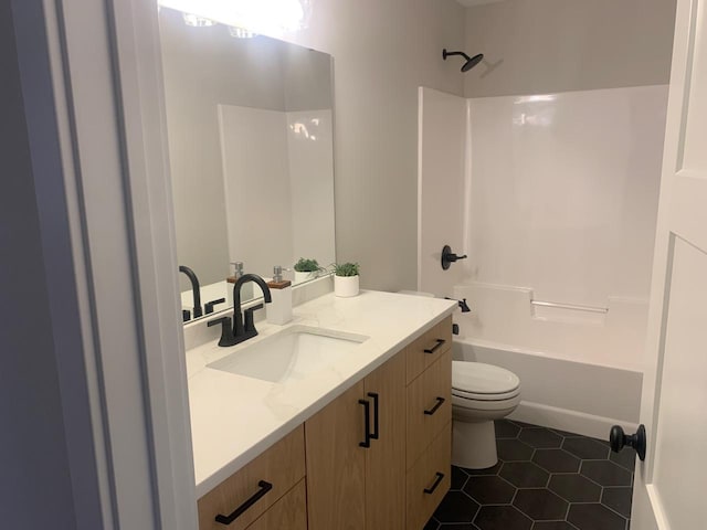 full bathroom featuring tile patterned flooring, shower / bathing tub combination, vanity, and toilet