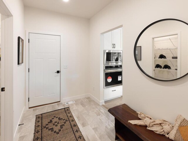 foyer entrance with baseboards