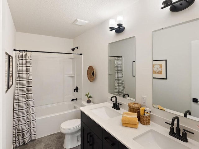 full bathroom featuring vanity, toilet, a textured ceiling, and shower / tub combo with curtain