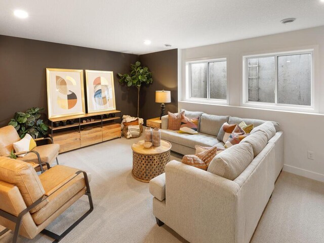 living area featuring carpet flooring, recessed lighting, and baseboards