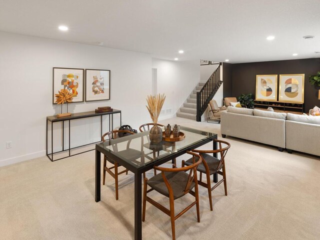 dining room featuring stairway, recessed lighting, light colored carpet, and baseboards