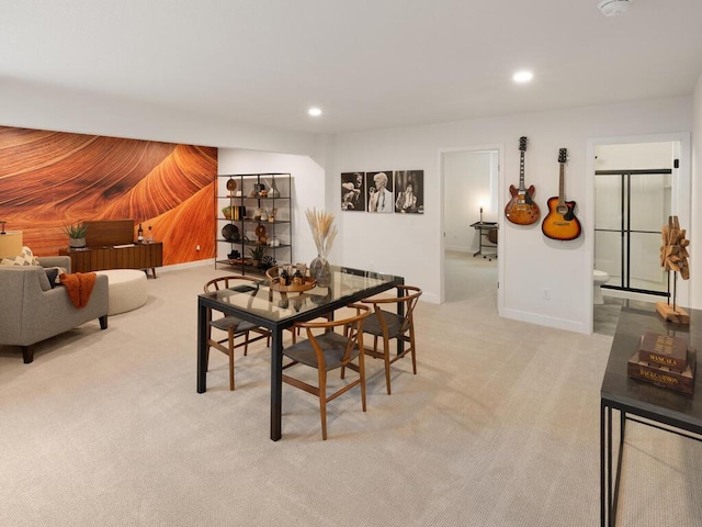 dining room with light carpet