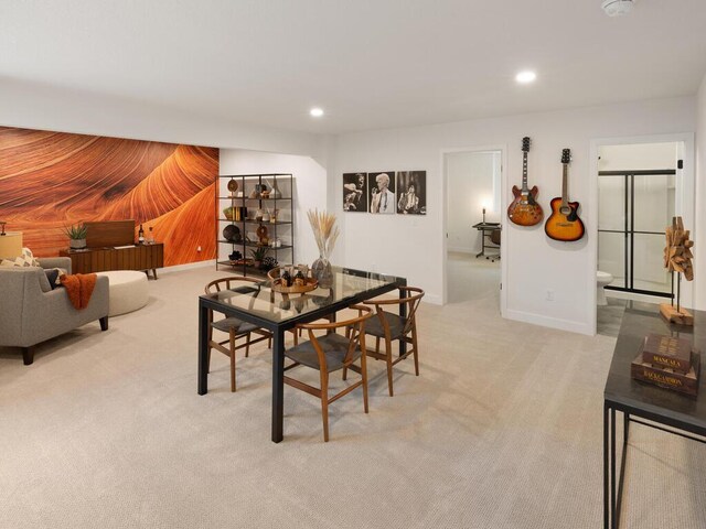 dining area with light carpet, recessed lighting, baseboards, and wooden walls