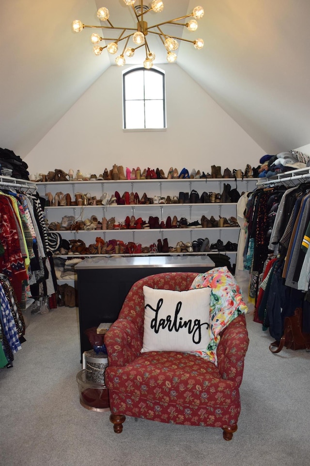 walk in closet featuring carpet flooring and lofted ceiling