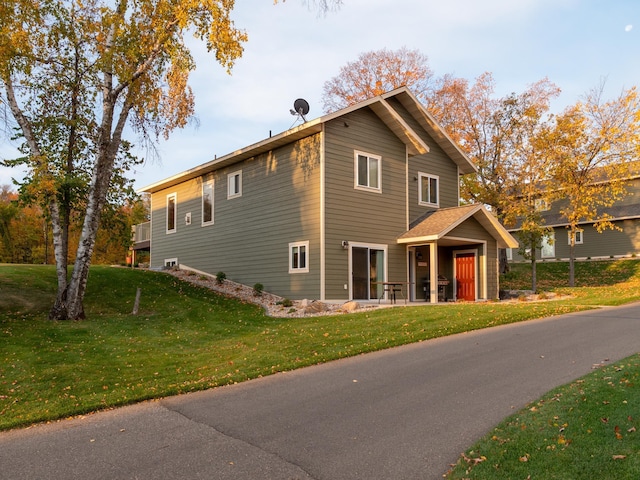 view of home's exterior featuring a yard