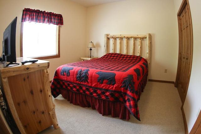 carpeted bedroom with a closet