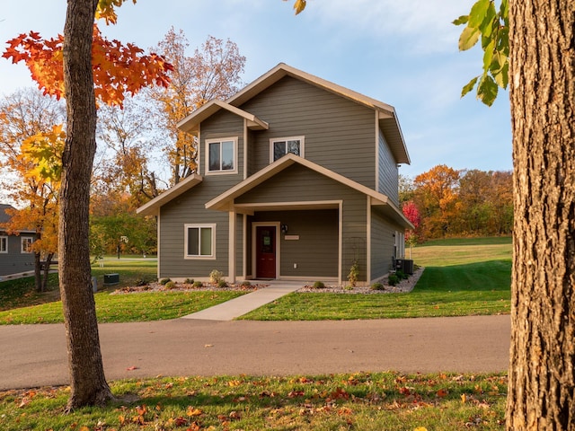 view of front facade with central AC unit and a front lawn