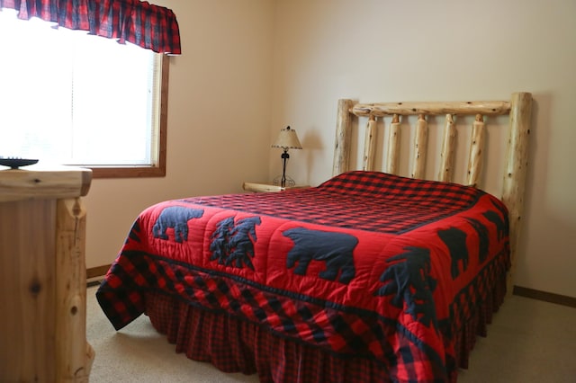 bedroom with light carpet