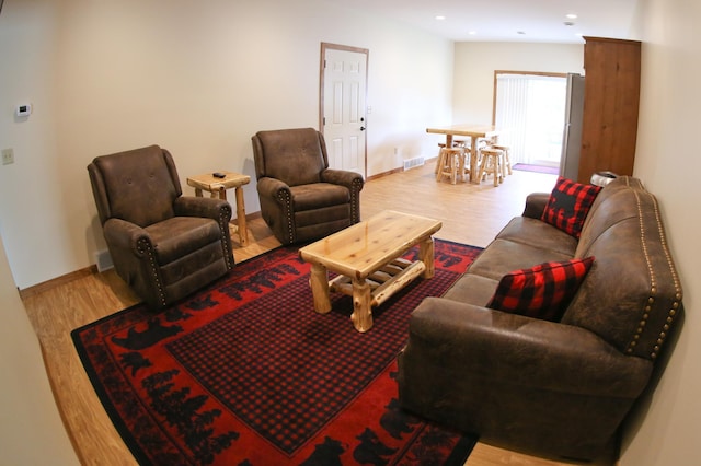 living room with light hardwood / wood-style floors